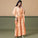 Front View of a Model wearing Orange Shibori V-Neck Kaftan Jumpsuit