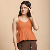 Front View of a Model wearing Orange Pleated Camisole Top