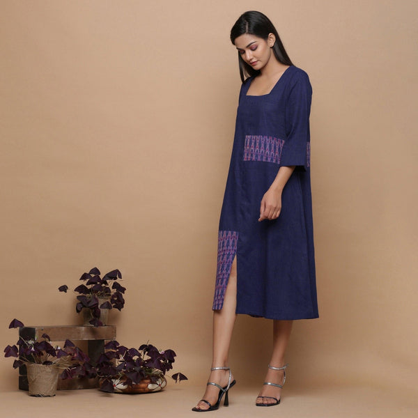 Left View of a Model wearing Paneled Ikat Blue Handspun Slit Dress