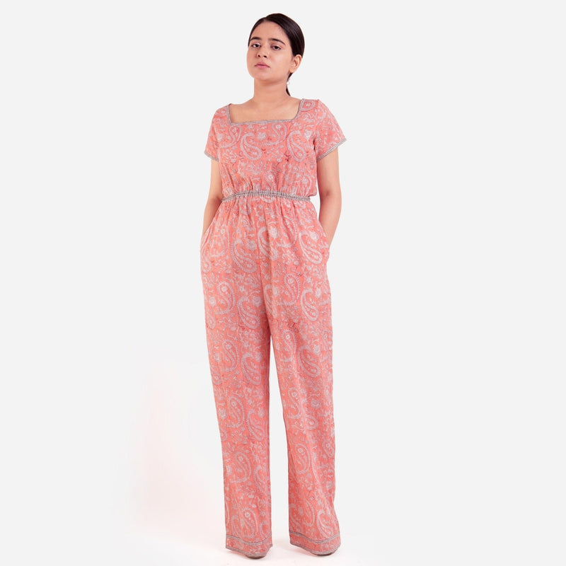 Front View of a Model wearing Peach Square Neck High Rise Jumpsuit