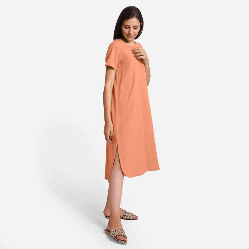 Right View of a Model wearing Peach Cotton Welt Pocket Shift Dress