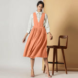 Front View of a Model wearing Peach Cotton Flax Pinafore Midi Wrap Dress