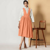 Front View of a Model wearing Peach Cotton Flax Pinafore Midi Wrap Dress