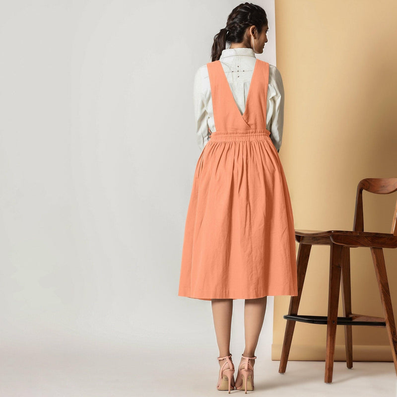 Back View of a Model wearing Peach Cotton Flax Pinafore Midi Wrap Dress