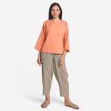 Front View of a Model wearing Peach Cotton Flax Round Neck A-Line Top