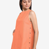 Left Detail of a Model wearing Peach Cotton Flax Kangaroo Pocket Dress