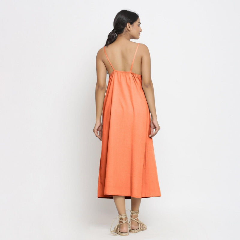 Back View of a Model wearing Peach Cotton Flax Strap Sleeve A-Line Dress