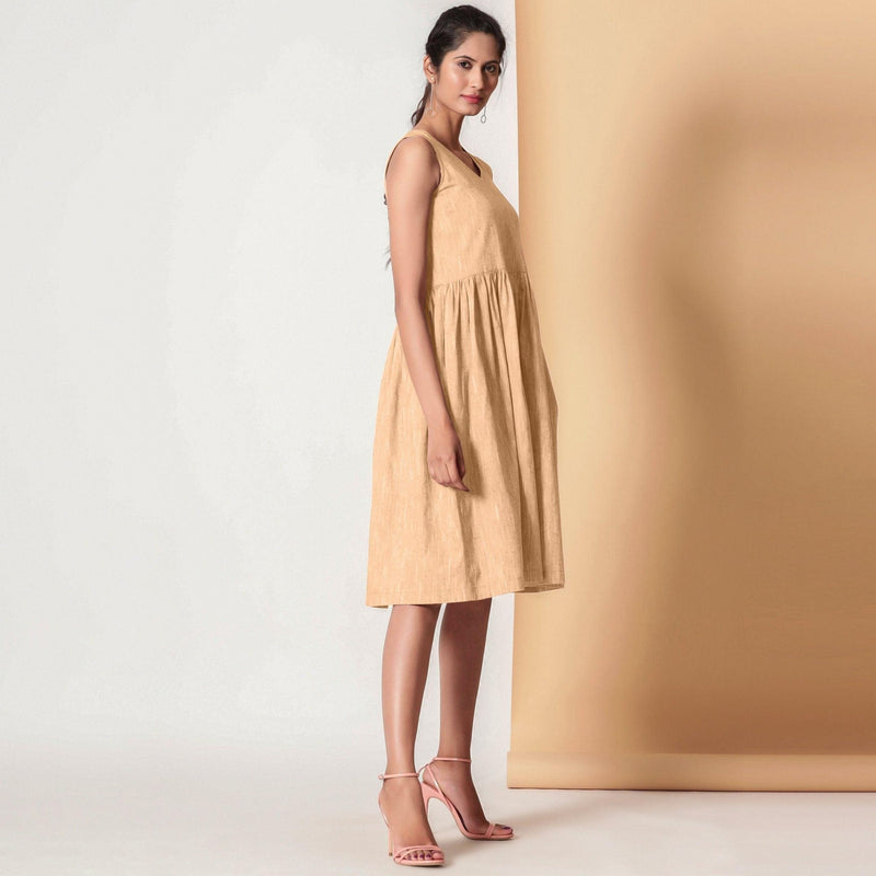 Right View of a Model wearing Cotton Peach Mellow Gathered Yoke Dress