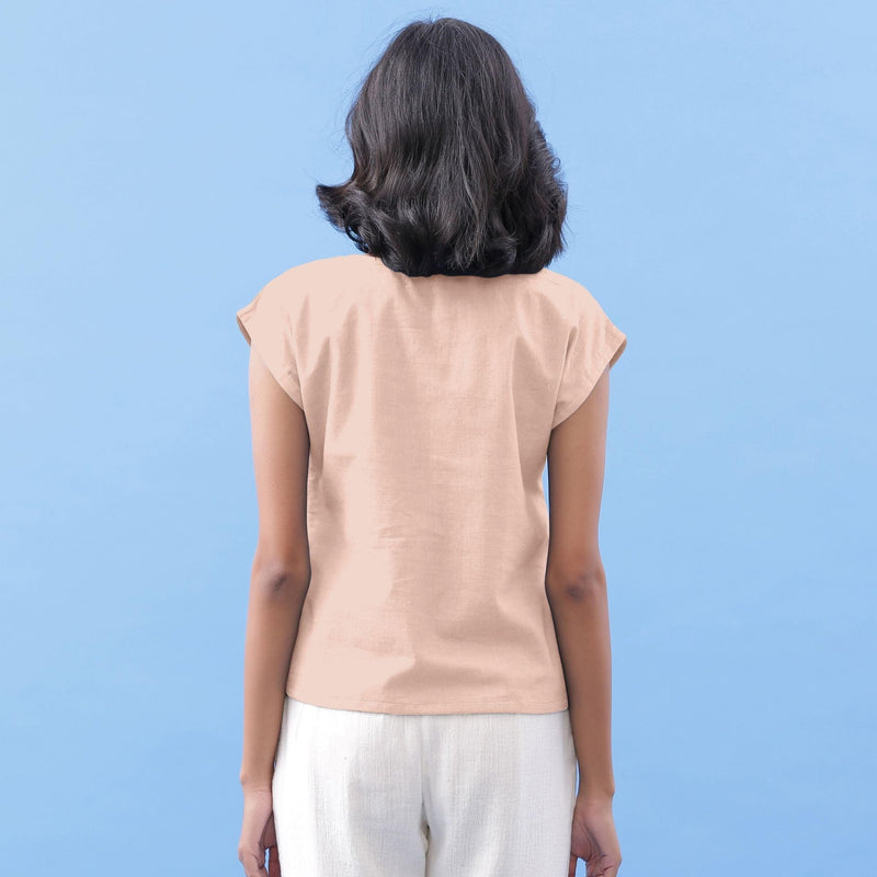 Back View of a Model wearing Peach Vegetable Dyed Handspun Cotton Essential Top