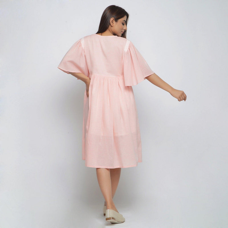 Back View of a Model wearing Peach Lined Cotton Chambray Dress