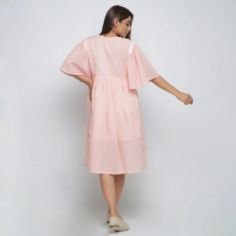 Back View of a Model wearing Peach Lined Cotton Chambray Dress