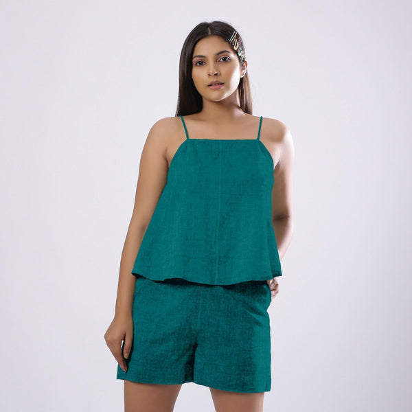 Front View of a Model wearing Pine Green 100% Linen Flared Camisole Top