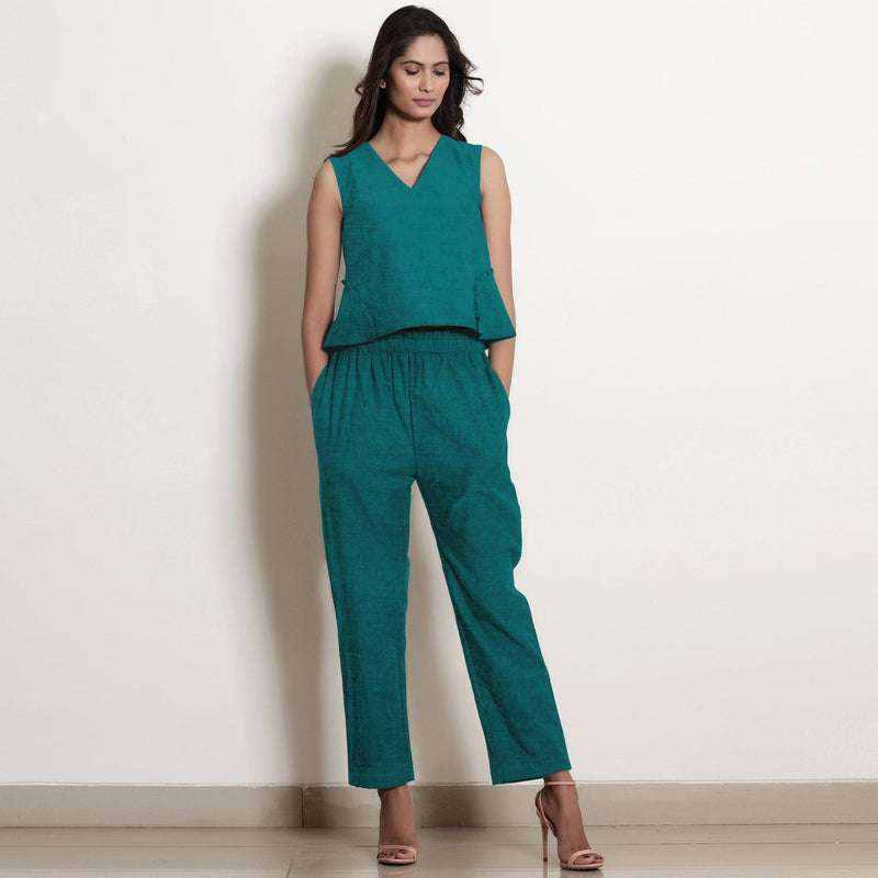 Front View of a Model wearing Pine Green Linen V-Neck Flared Godet Top