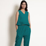 Front View of a Model wearing Pine Green Linen V-Neck Flared Godet Top