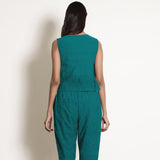 Back View of a Model wearing Pine Green Linen V-Neck Flared Godet Top