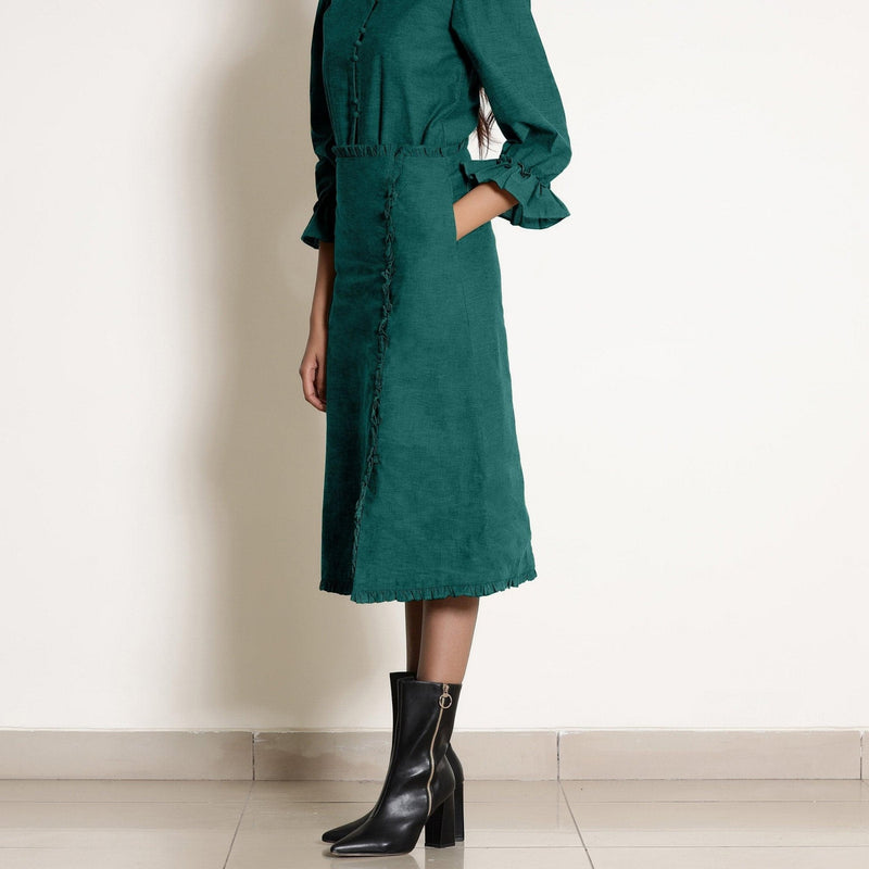 Left View of a Model wearing Warm Pine Green A-Line Frilled Skirt