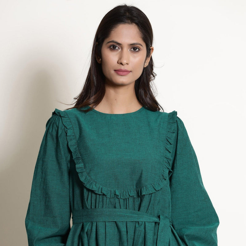 Front View of a Model wearing Warm Pine Green Frilled Yoke Dress