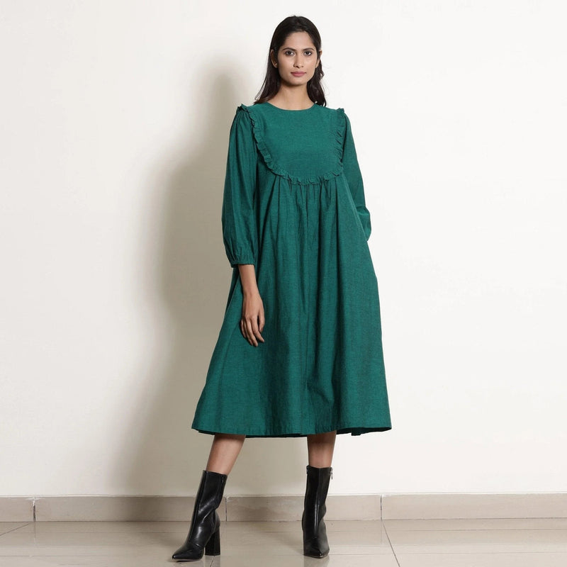 Front View of a Model wearing Pine Green Warm Cotton Frilled Midi Yoke Dress