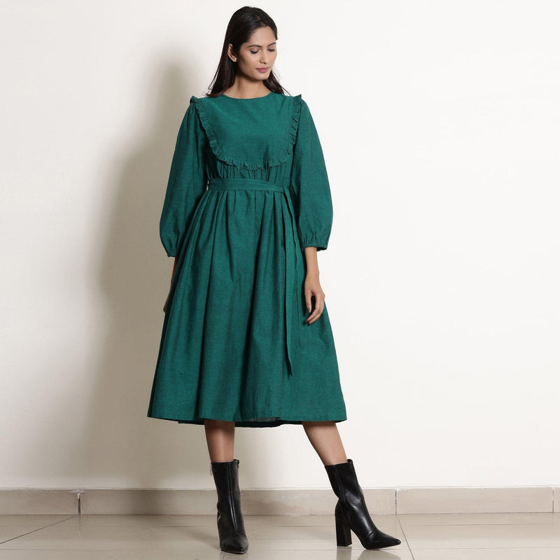 Front View of a Model wearing Warm Pine Green Frilled Yoke Dress