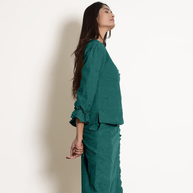 Right View of a Model wearing Pine Green Frilled Sleeve Button Down Top