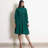 Front View of a Model wearing Warm Pine Green Fit and Flare Dress