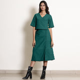 Front View of a Model wearing Pine Green Wrap Top and A-Line Skirt Set