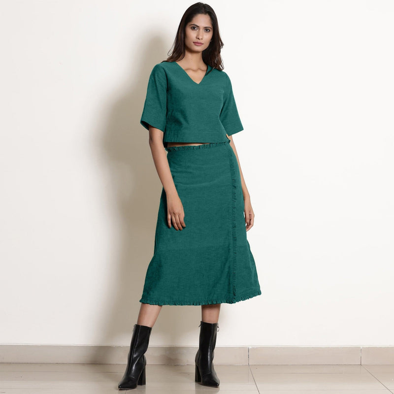 Front View of a Model wearing Pine Green Wrap Top and A-Line Skirt Set