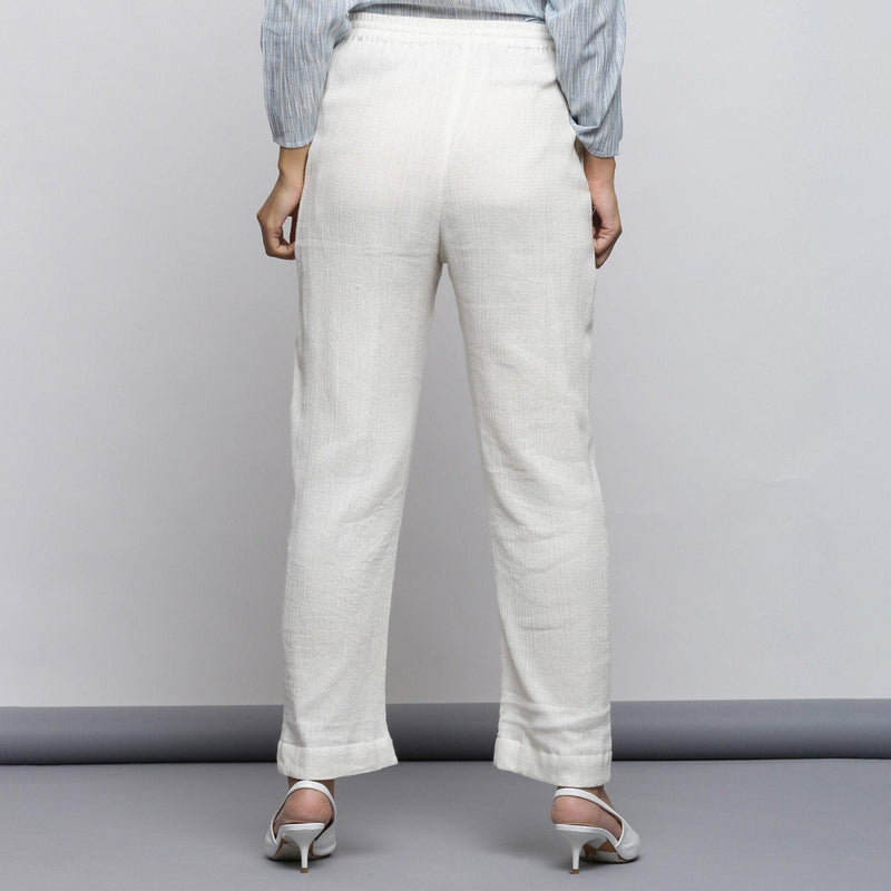 Back View of a Model wearing Off-White Crinkled Cotton Tapered Pant