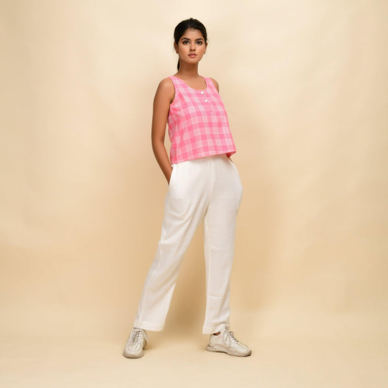 Right View of a Model wearing Pink Checks Cotton Muslin Sleeveless Short Top