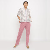 Front View of a Model wearing Cotton Flax Mid-Rise Pink Tapered Pant