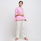 Front View of a Model wearing Pink Tie Dyed Flowy Cotton Gathered Top