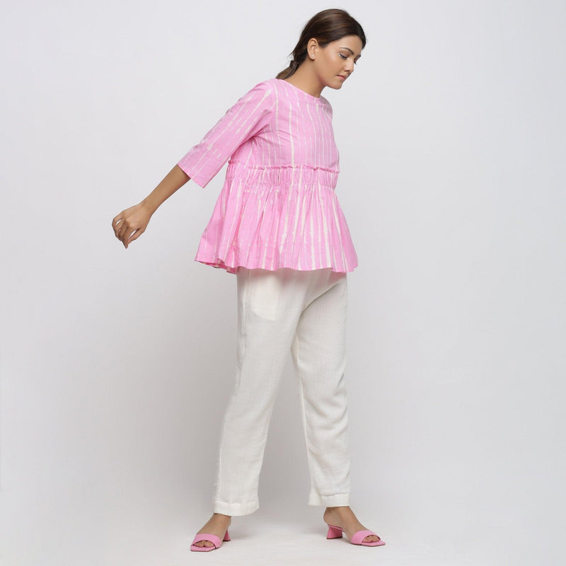 Right View of a Model wearing Pink Tie Dyed Flowy Cotton Gathered Top