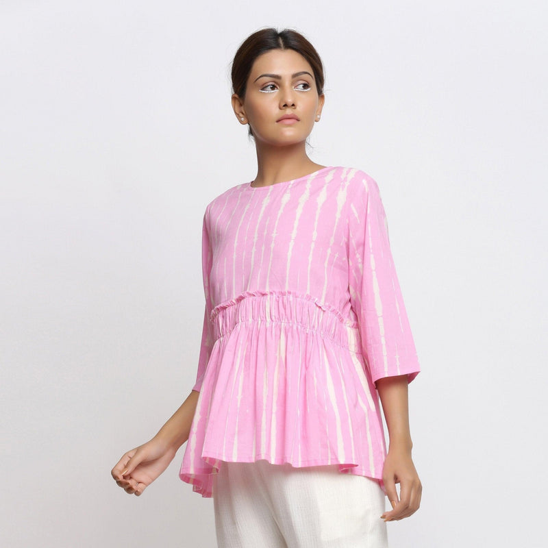 Front View of a Model wearing Pink Tie Dyed Flowy Cotton Gathered Top