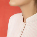 Close View of a Model wearing Pink Vegetable Dyed Button-Down Dress