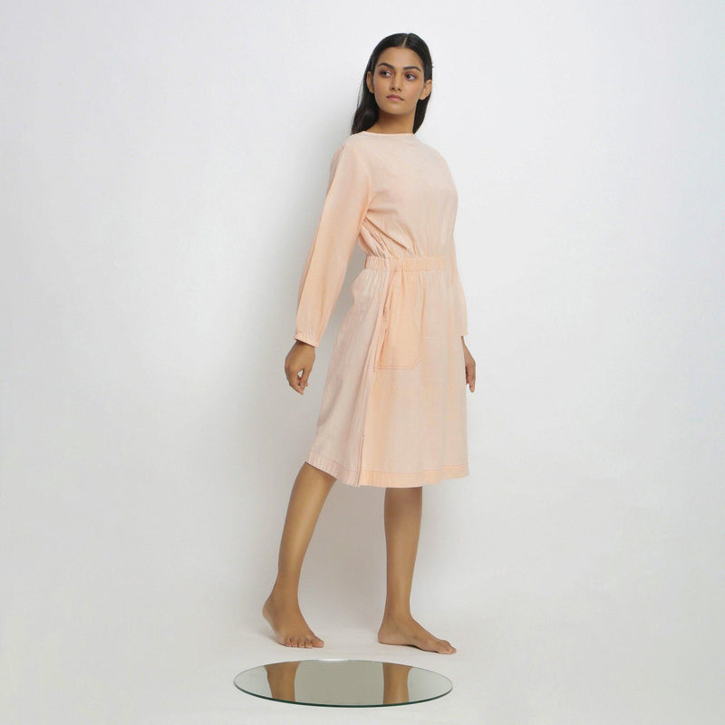 Right View of a Model wearing Vegetable Dyed Bishop Sleeves Dress