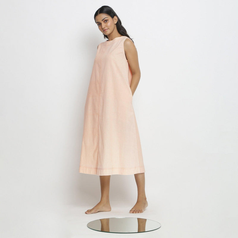 Left View of a Model wearing Pink Vegetable Dyed Cotton Paneled A-Line Midi Dress