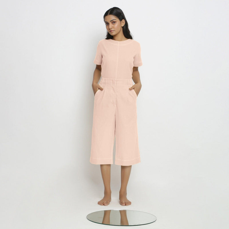 Front View of a Model wearing Vegetable Dyed Pink 100% Cotton Mid-Rise Culottes