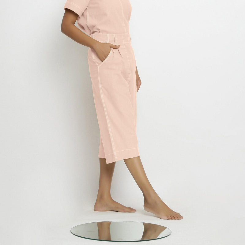 Right View of a Model wearing Vegetable Dyed Pink 100% Cotton Mid-Rise Culottes