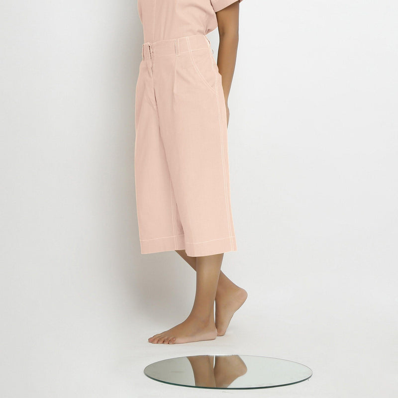 Left View of a Model wearing Vegetable Dyed Pink 100% Cotton Mid-Rise Culottes