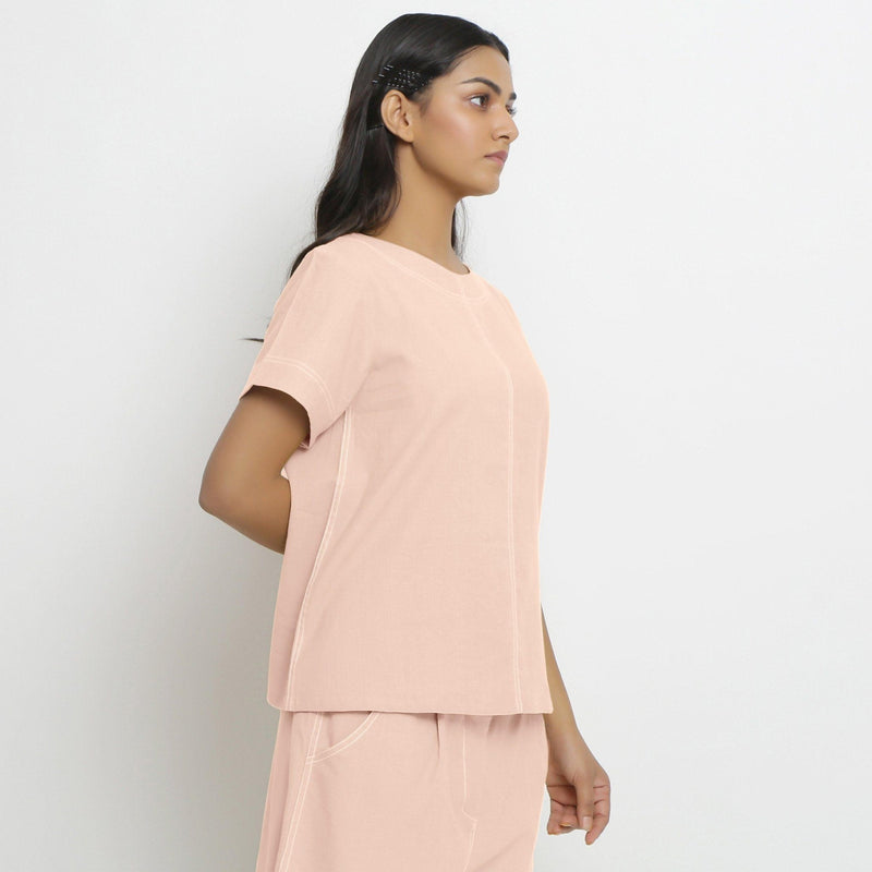 Right View of a Model wearing Vegetable-Dyed Pink 100% Cotton Paneled Top