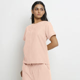 Left View of a Model wearing Vegetable-Dyed Pink 100% Cotton Paneled Top