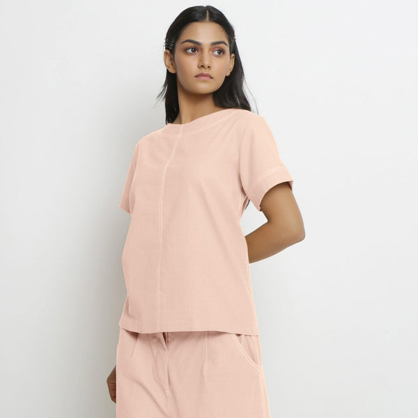 Left View of a Model wearing Vegetable-Dyed Pink 100% Cotton Paneled Top