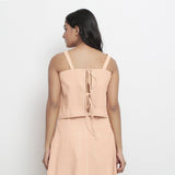 Back View of a Model wearing Vegetable-Dyed Pink 100% Cotton Spaghetti Top