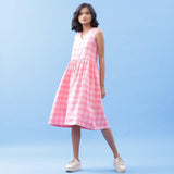 Front View of a Model wearing Handspun Cotton Pink Checks Yoke Dress