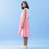 Left View of a Model wearing Handspun Cotton Pink Checks Yoke Dress