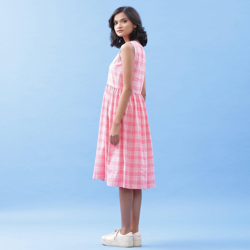 Left View of a Model wearing Handspun Cotton Pink Checks Yoke Dress