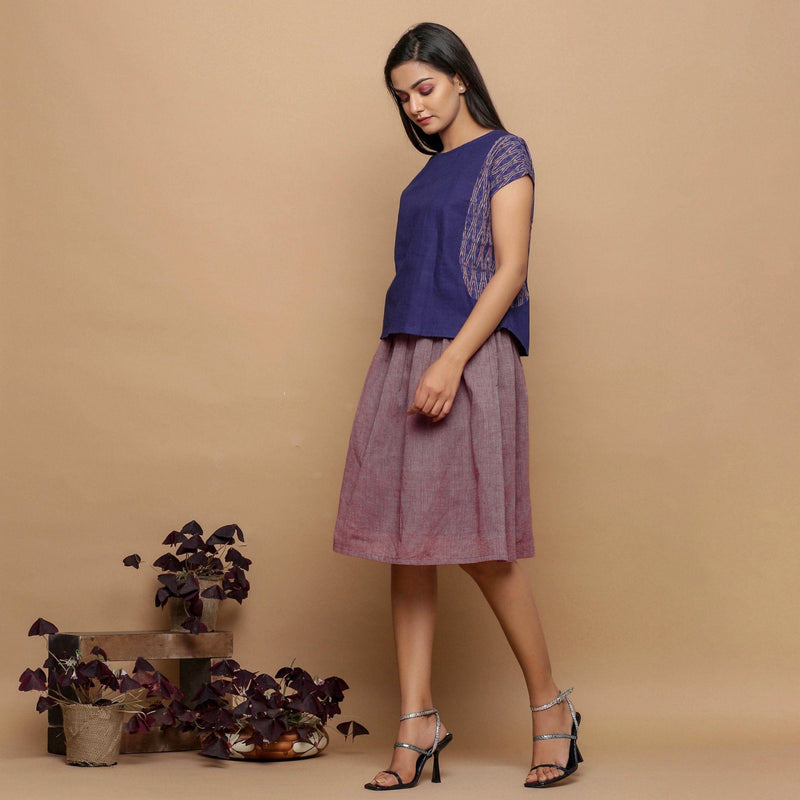 Left View of a Model wearing Plum Handspun Handwoven Paperbag Skirt