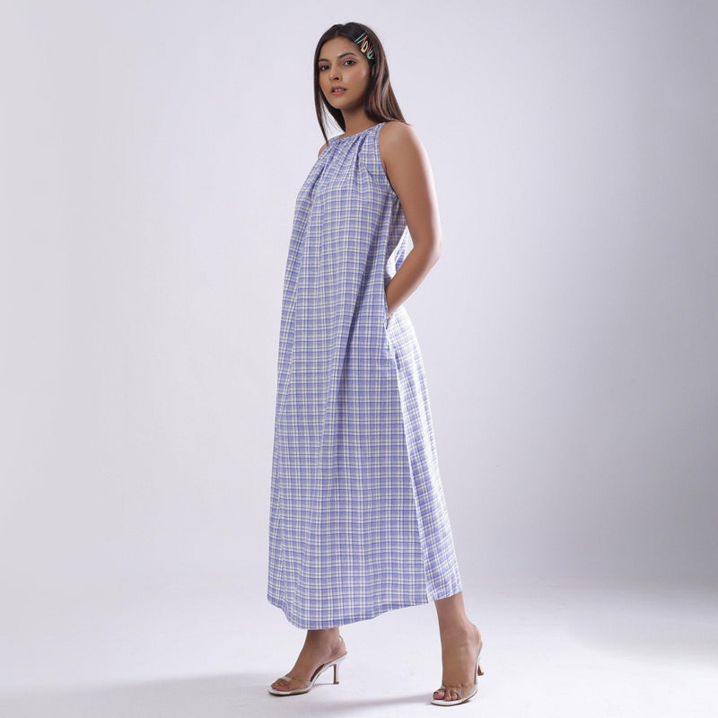 Left View of a Model wearing Powder Blue Checks Handspun Cotton Maxi Flared Dress