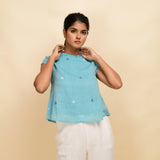 Front View of a Model wearing Powder Blue Cotton Muslin Ruffled Collar Jamdani Top