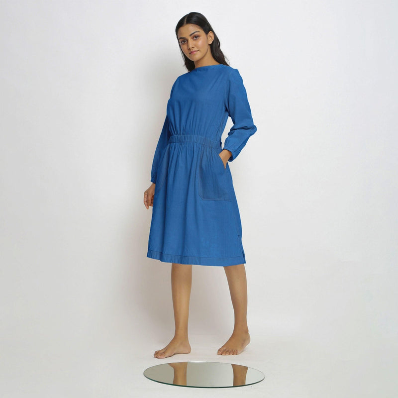 Left View of a Model wearing Vegetable-Dyed Blue 100% Cotton Dress